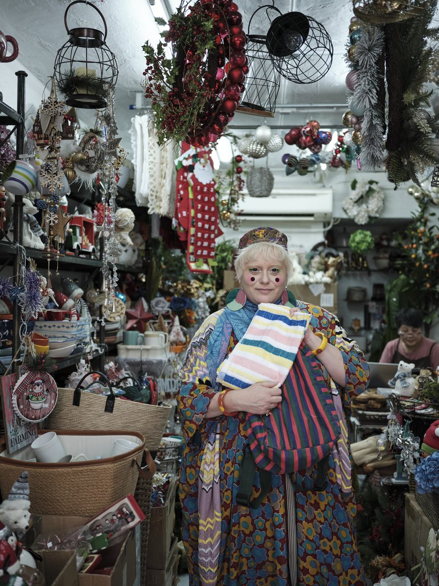 Bethan Laura Wood among the market stalls, Hong Kong