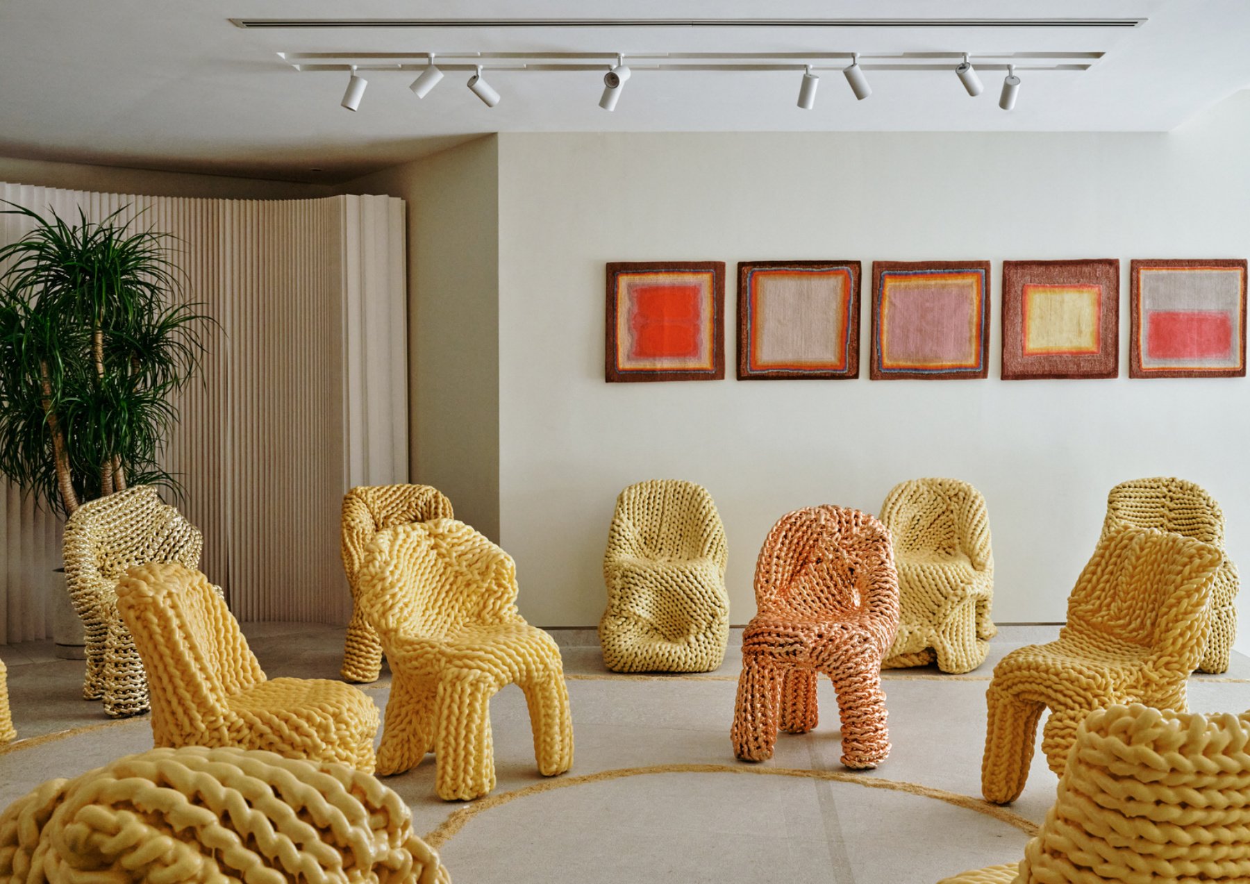 The listening room — chairs and framed T.C.O.C. compositions